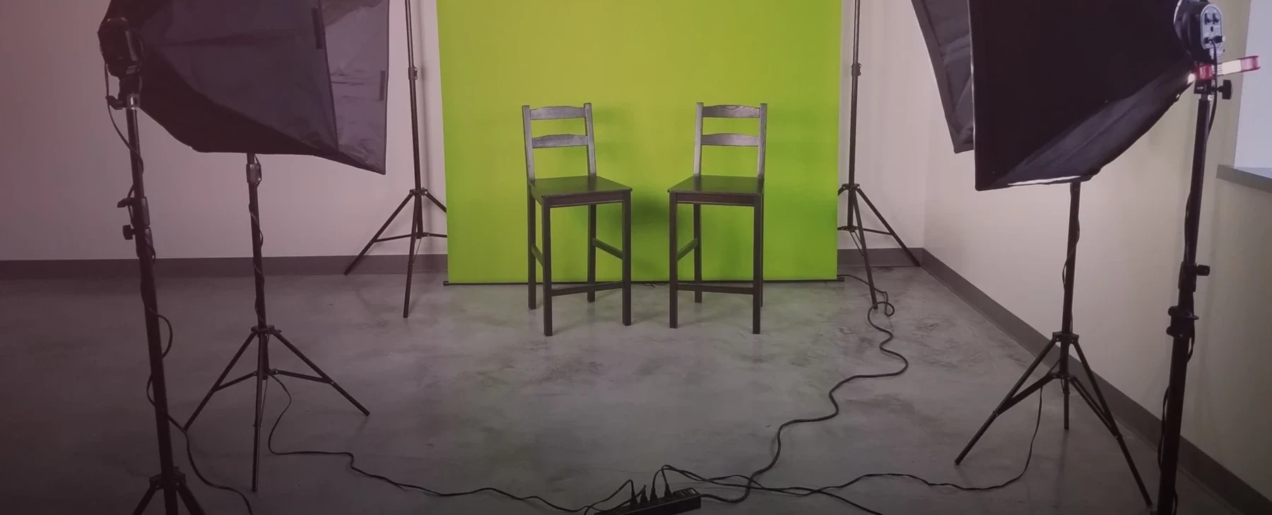 Video production studio with lighting and green screen