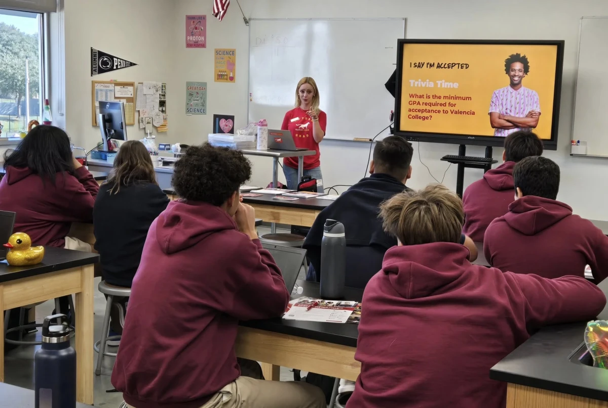 Central Florida Prep high school students in maroon uniforms listen to a classroom presentation about college admission requirements