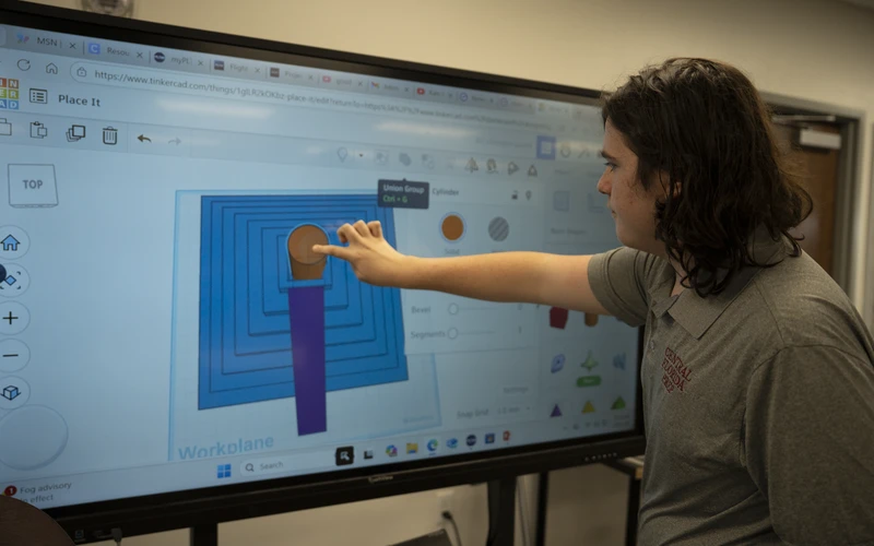 A Central Florida Prep student working at an interactive board